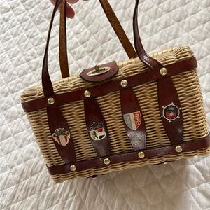 Vintage Woven Rattan Tote with Brown Leather Straps and Crest Accents